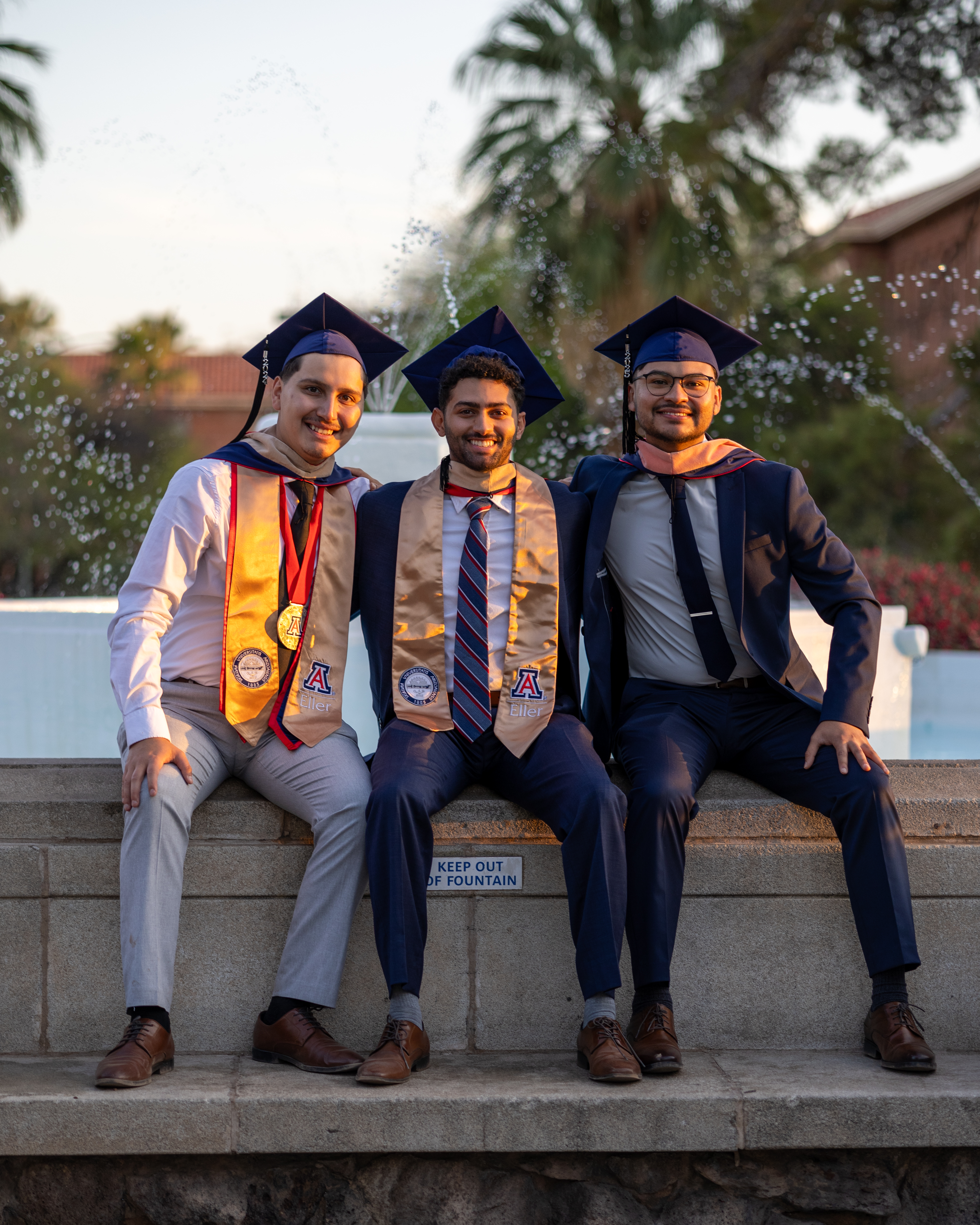 Graduation trio portrait photographed by Oros Photography