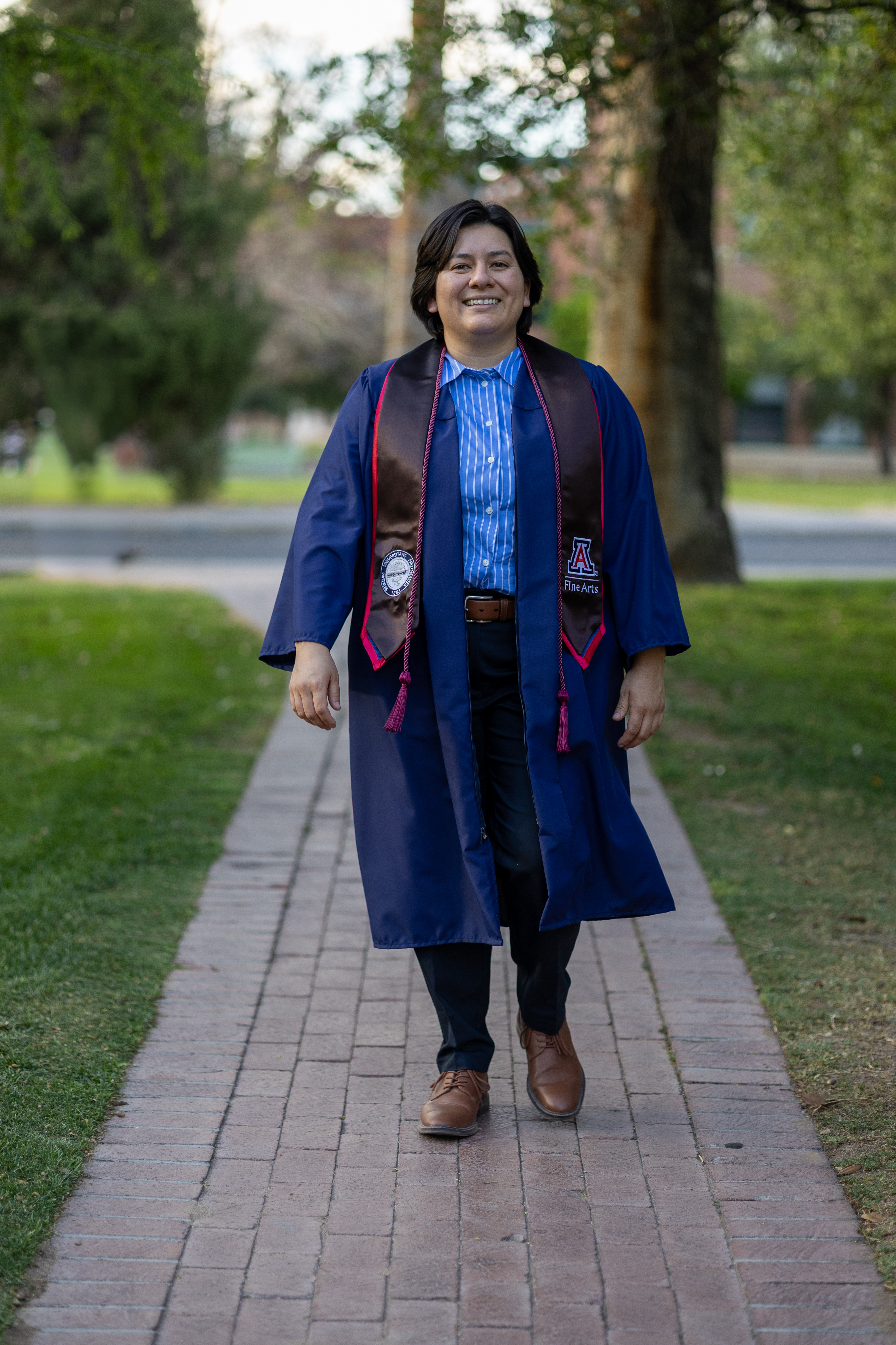 Graduation portrait photographed outdoors by Oros Photography