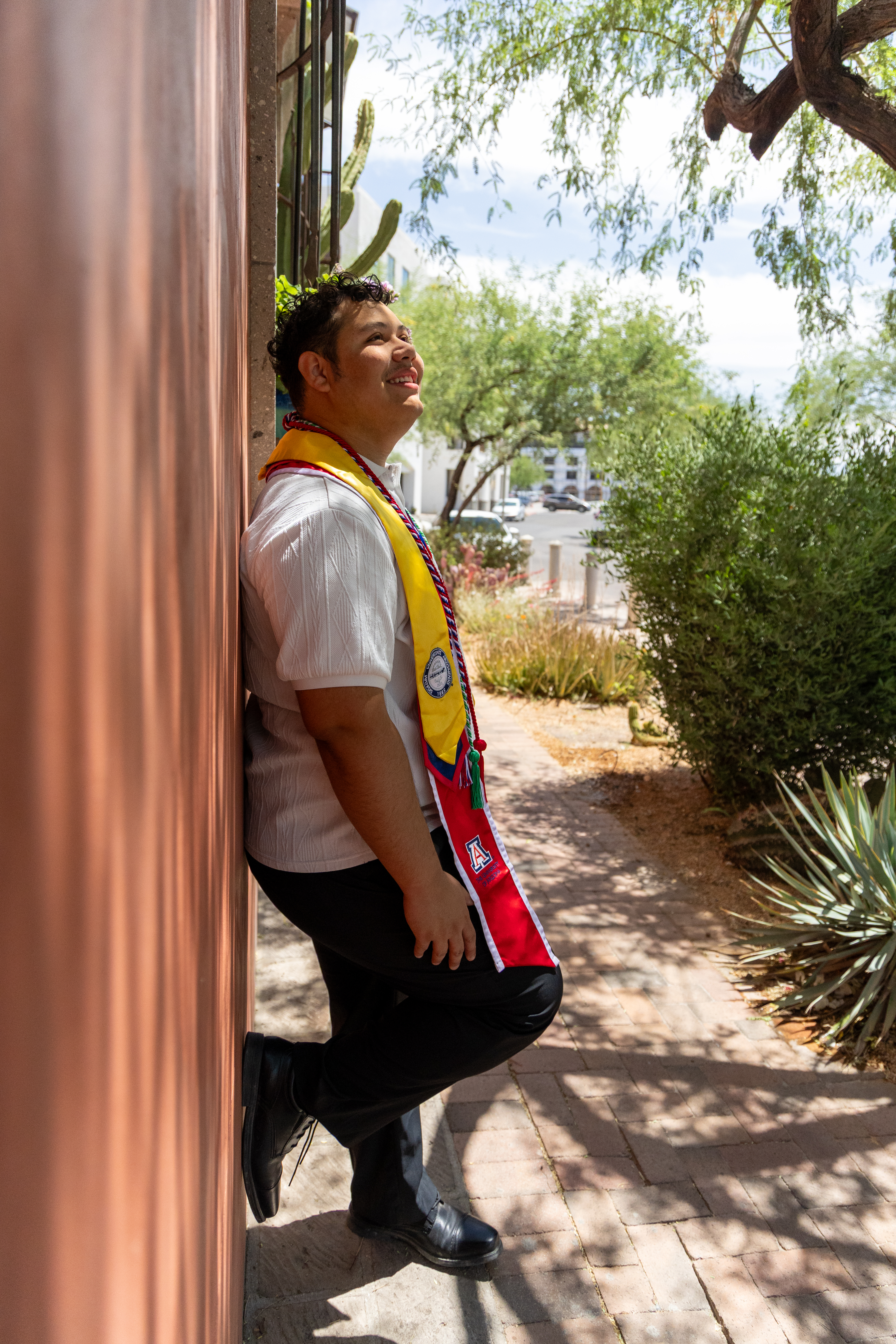 Graduation portrait in natural outdoor light photographed by Oros Photography